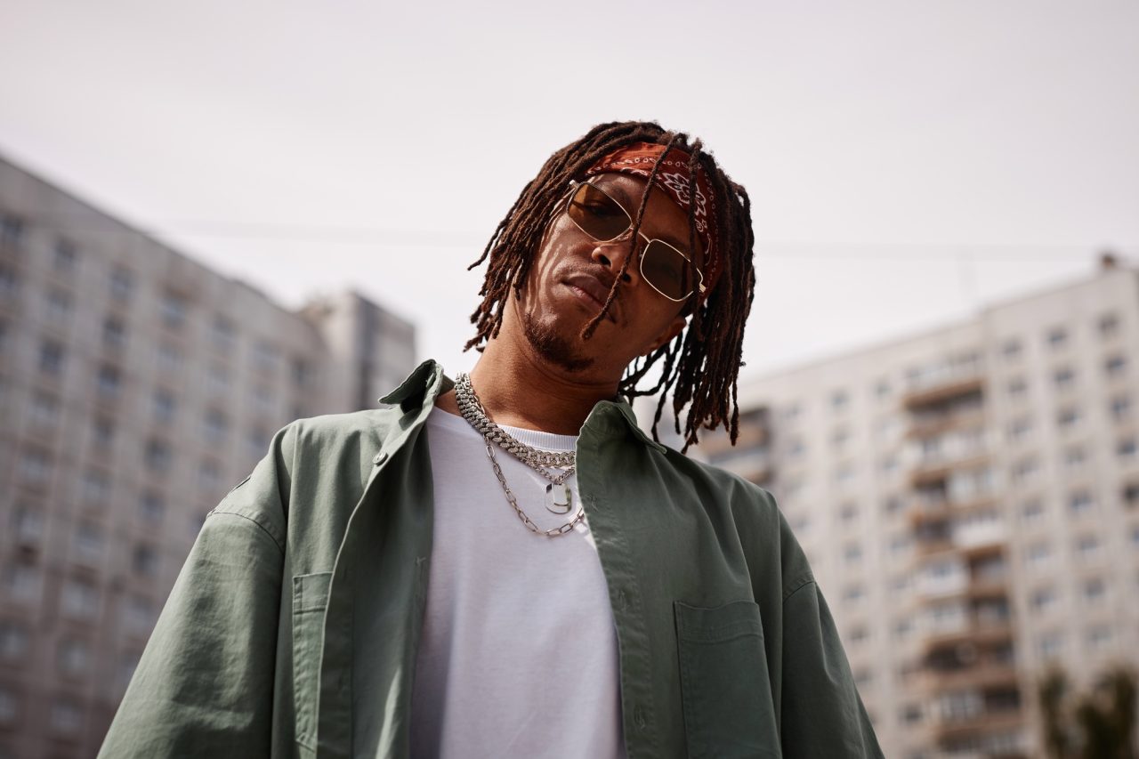 serious young african american man in sunglasses and stylish casualwear.jpg